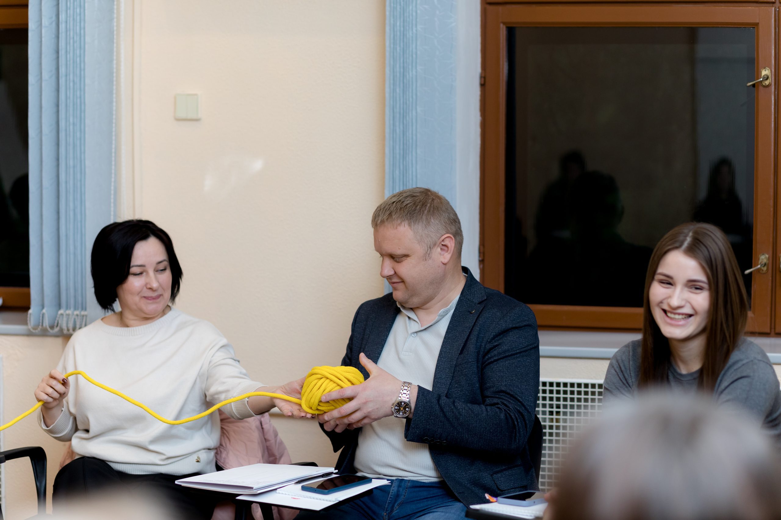 participant holding a yellow rope